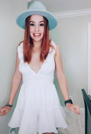 4. Sexy Estephani Shows Cleavage in White Dress Braless