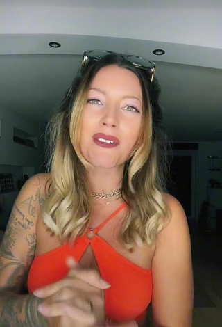 2. Sexy Aline Jost Shows Cleavage in Orange Crop Top