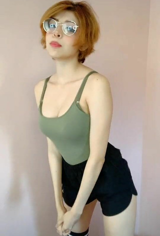 3. Seductive Didi Shows Cleavage in Olive Top