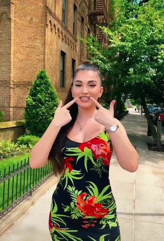 6. Sexy Enisa Shows Cleavage in Floral Dress in a Street