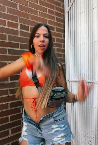 Hot Esther Martinez Shows Cleavage in Orange Bikini Top