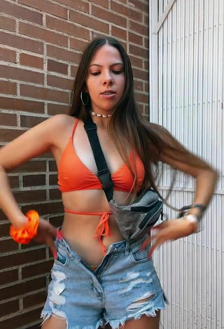 5. Hot Esther Martinez Shows Cleavage in Orange Bikini Top