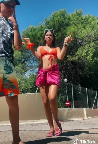 5. Sexy Esther Martinez Shows Cleavage in Orange Bikini Top