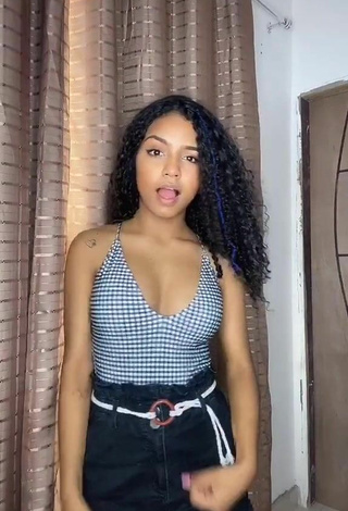 Hot Radija Pereira Shows Cleavage in Checkered Top