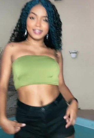 Hot Radija Pereira Shows Cleavage in Olive Tube Top