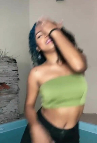 4. Hot Radija Pereira Shows Cleavage in Olive Tube Top
