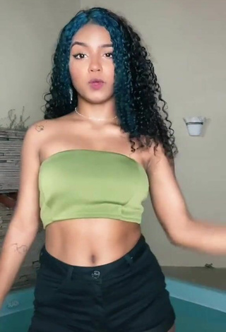 2. Sexy Radija Pereira Shows Cleavage in Olive Tube Top