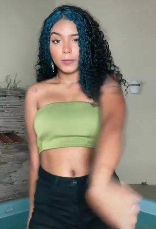 3. Sexy Radija Pereira Shows Cleavage in Olive Tube Top