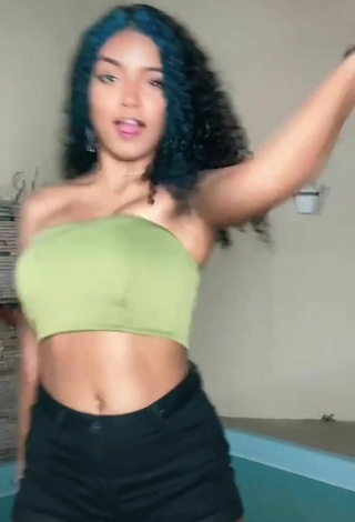 4. Sexy Radija Pereira Shows Cleavage in Olive Tube Top