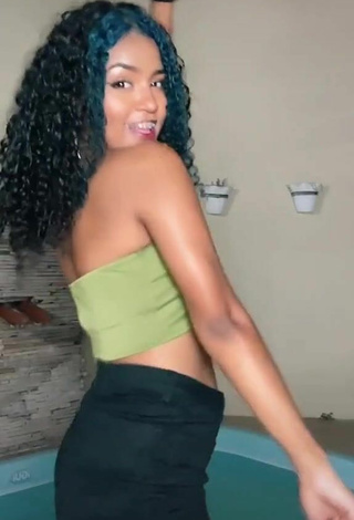 6. Sexy Radija Pereira Shows Cleavage in Olive Tube Top