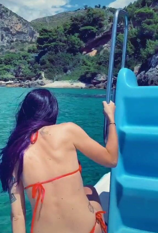 3. Erotic Giulia Penna Shows Cleavage in Red Bikini