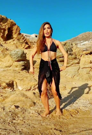 Sexy Gloria Trevi Shows Cleavage in Black Bikini Top