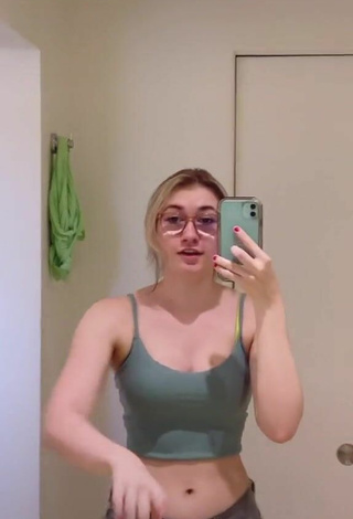 2. Cute Sydney Shows Cleavage in Olive Crop Top