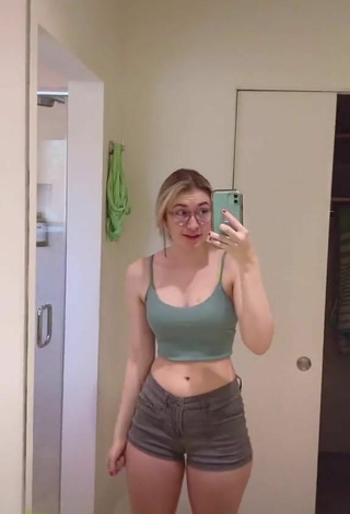 2. Hot Sydney Shows Cleavage in Olive Crop Top