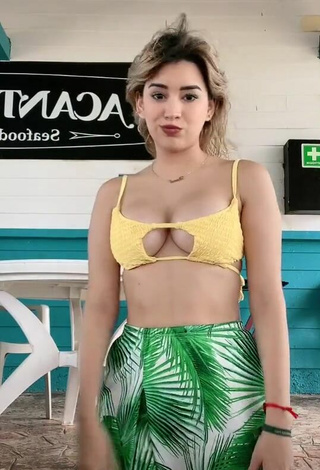 2. Erotic Brianda Deyanara Moreno Guerrero Shows Cleavage in Yellow Bikini Top