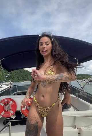 4. Sexy Pamella Fuego Shows Cleavage in Leopard Bikini on a Boat