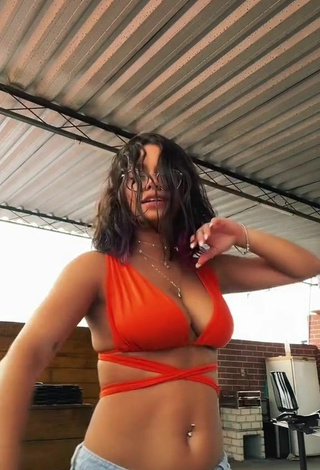 3. Cute Maria Clara Garcia Shows Cleavage in Orange Bikini Top