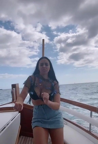 3. Sexy Carla Flila Shows Cleavage in Black Bra on a Boat