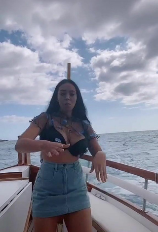4. Sexy Carla Flila Shows Cleavage in Black Bra on a Boat