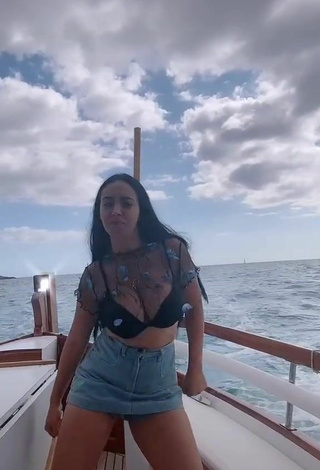 5. Sexy Carla Flila Shows Cleavage in Black Bra on a Boat