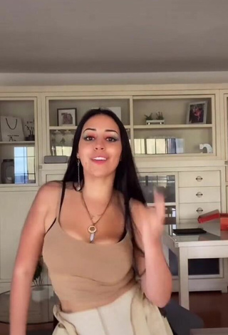 2. Sexy Carla Flila Shows Cleavage in Beige Top