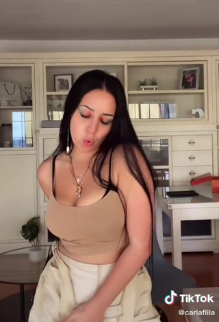 3. Sexy Carla Flila Shows Cleavage in Beige Top