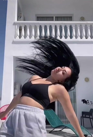 2. Beautiful Carla Flila Shows Cleavage in Sexy Black Crop Top