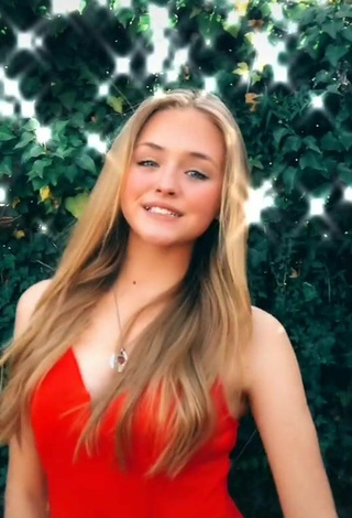 2. Sexy Bella Messens Shows Cleavage in Red Dress