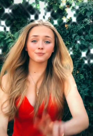 3. Sexy Bella Messens Shows Cleavage in Red Dress