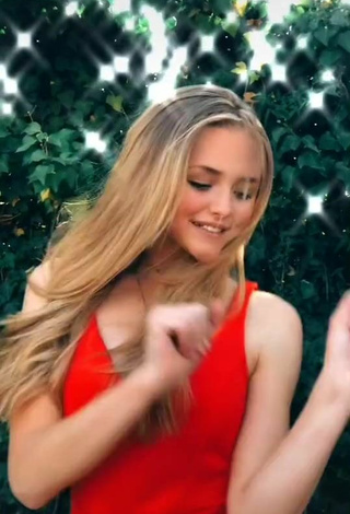 5. Sexy Bella Messens Shows Cleavage in Red Dress
