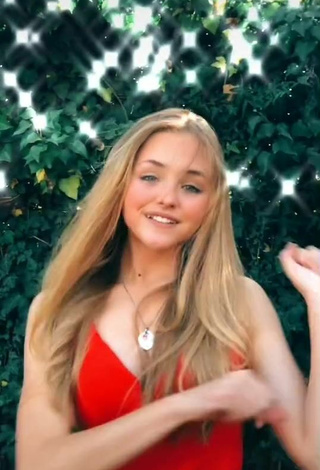 6. Sexy Bella Messens Shows Cleavage in Red Dress