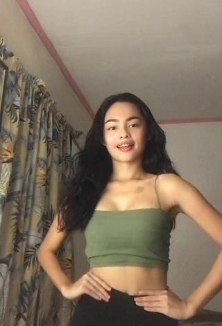 6. Cute Isabel Luche Shows Cleavage in Olive Crop Top