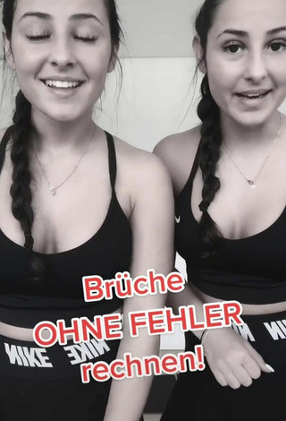 5. Sexy jakictwins Shows Cleavage in Black Sport Bra