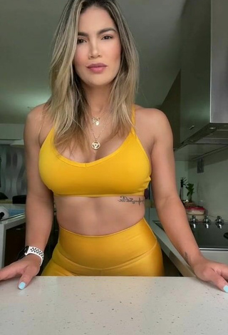 2. Hottest Laura Fuentes Shows Cleavage in Yellow Sport Bra