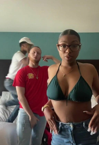 Erotic Destinyy Shows Cleavage in Green Bikini Top