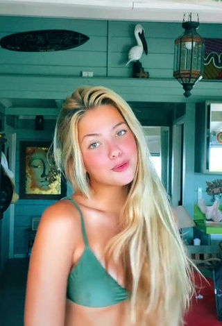Beautiful Maeva Reichert Shows Cleavage in Sexy Green Bikini Top