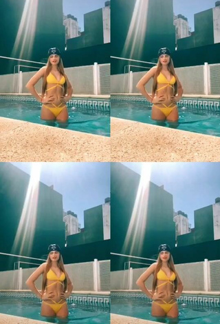 2. Sexy Maga Seggio Shows Cleavage in Yellow Bikini at the Pool