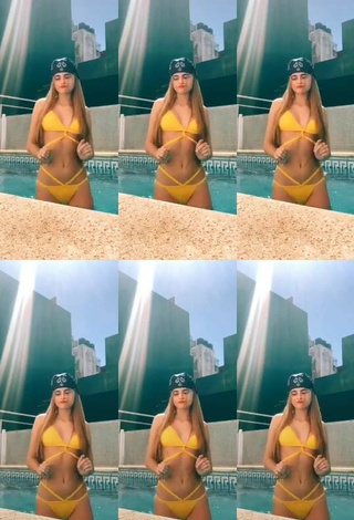 3. Sexy Maga Seggio Shows Cleavage in Yellow Bikini at the Pool