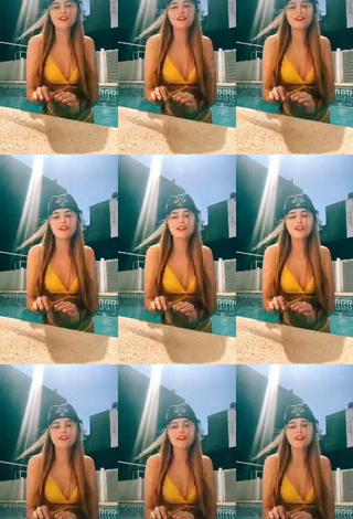 4. Sexy Maga Seggio Shows Cleavage in Yellow Bikini at the Pool