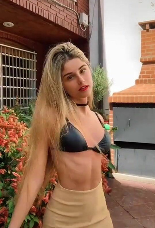 Sweetie Maga Seggio Shows Cleavage in Black Bikini Top