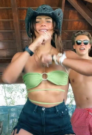 6. Cute Manu Barrios Shows Cleavage in Green Bikini Top