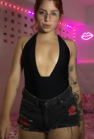 Sexy Marian Shows Cleavage in Black Bodysuit