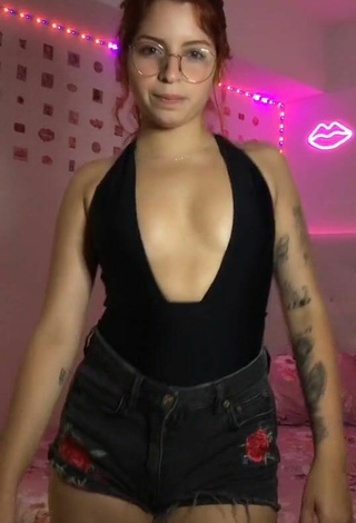 2. Sexy Marian Shows Cleavage in Black Bodysuit