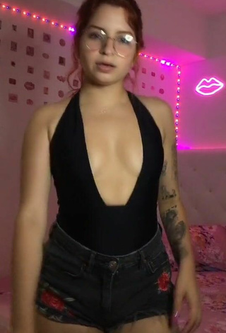 3. Sexy Marian Shows Cleavage in Black Bodysuit