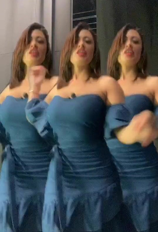 2. Alluring Milagro Flores Shows Cleavage in Erotic Turquoise Dress