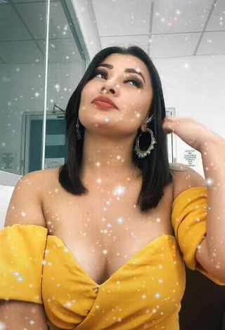 4. Sweet Milagro Flores Shows Cleavage in Cute Yellow Dress