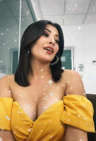 5. Sweet Milagro Flores Shows Cleavage in Cute Yellow Dress