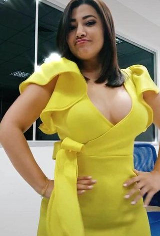 6. Hottie Milagro Flores Shows Cleavage in Yellow Dress