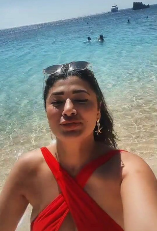 6. Breathtaking Milagro Flores Shows Cleavage at the Beach