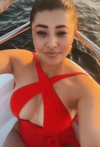 Hot Milagro Flores Shows Cleavage in Red Swimsuit on a Boat